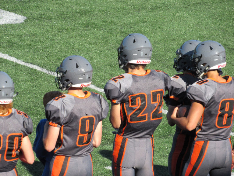 Eagles soar past Tigers in football opener