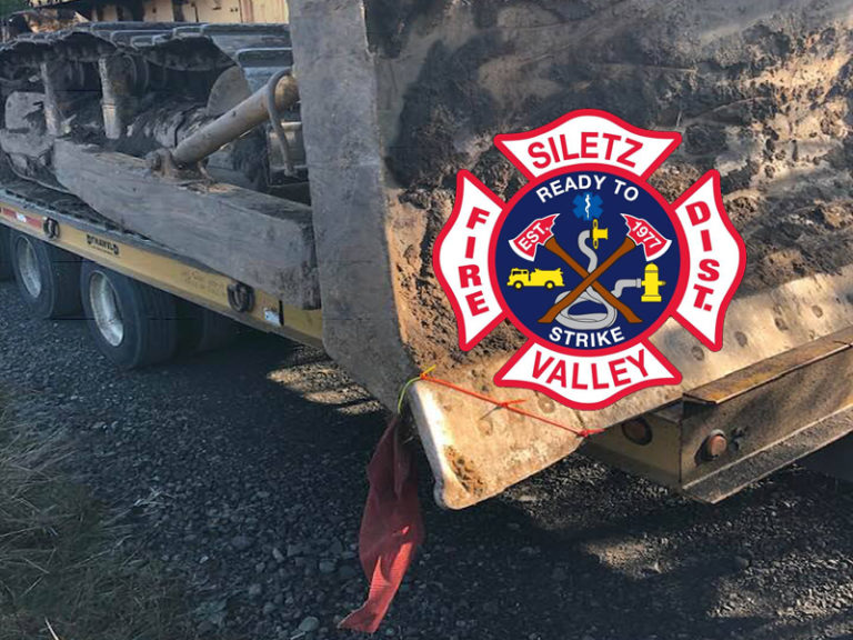 Man trapped under tractor blade in critical condition near Siletz