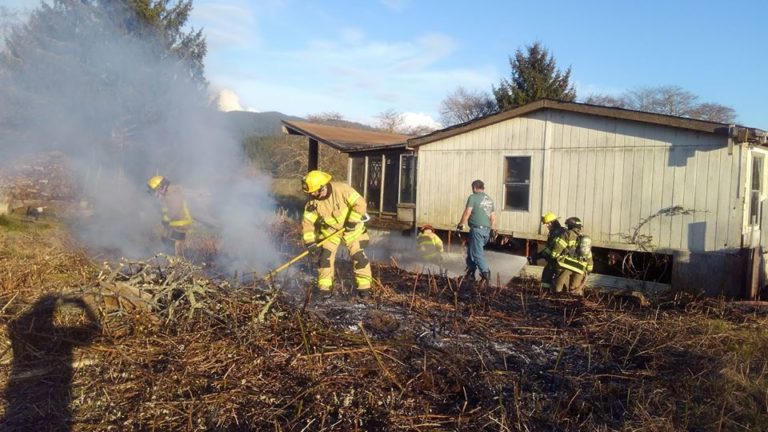 Unattended burn pile leads to NLFR response on S. Drift Creek Road