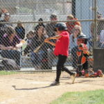 Kids nails one to the outfield