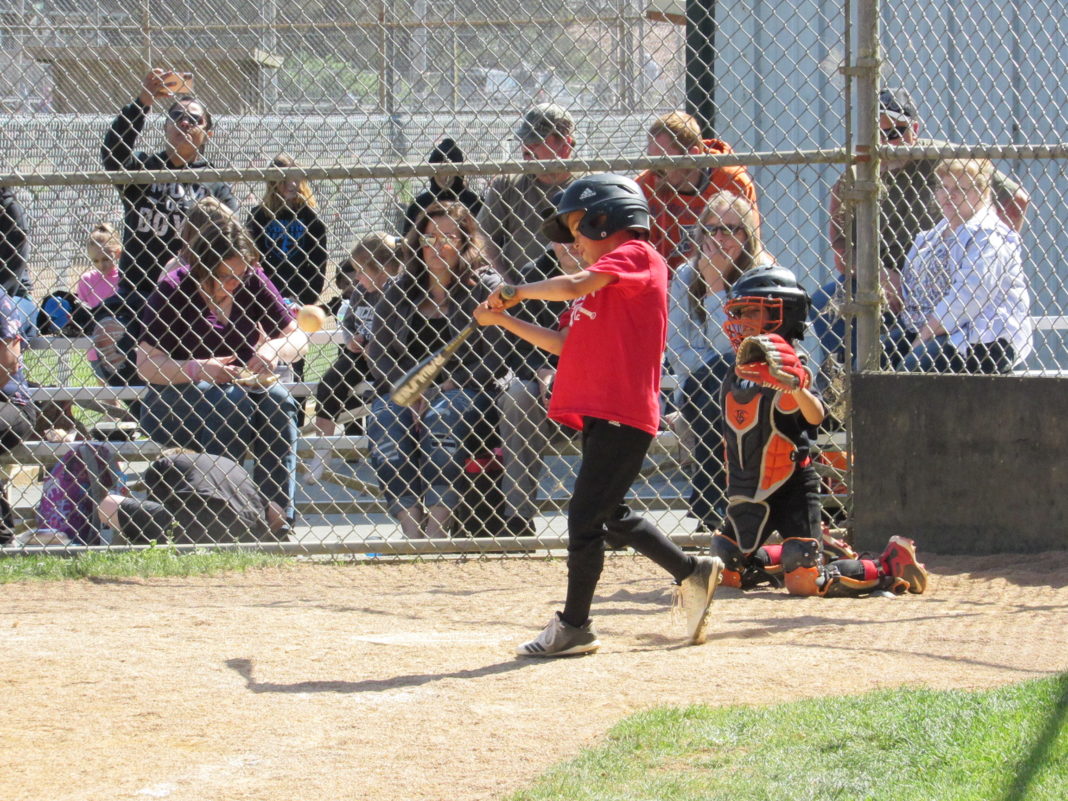 Kids nails one to the outfield